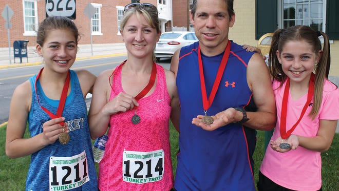 The medal-winning Snyder family includes, left to right, Braelyn, Stephanie, Terry and Brenna.