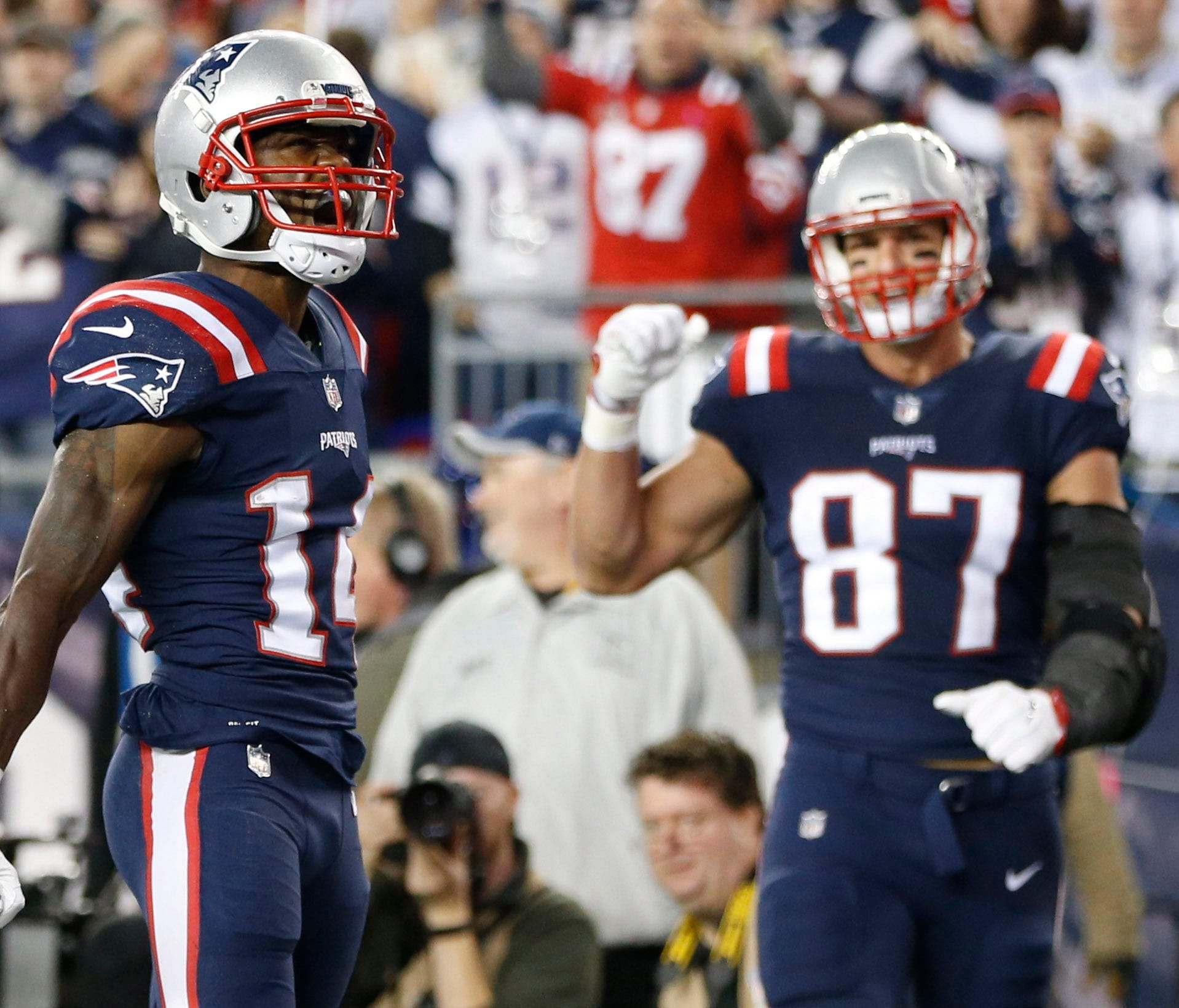 New England Patriots wide receiver Brandin Cooks (14) and tight end Rob Gronkowski (87) celebrate after scoring a touchdown during the first half against the Atlanta Falcons at Gillette Stadium.