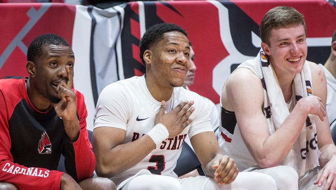 Ball State's Josh Thompson sits on the bench with teammates Francis Kiapway, left, and Sean Sellers during a game against Akron on Jan. 27 at Worthen Arena.