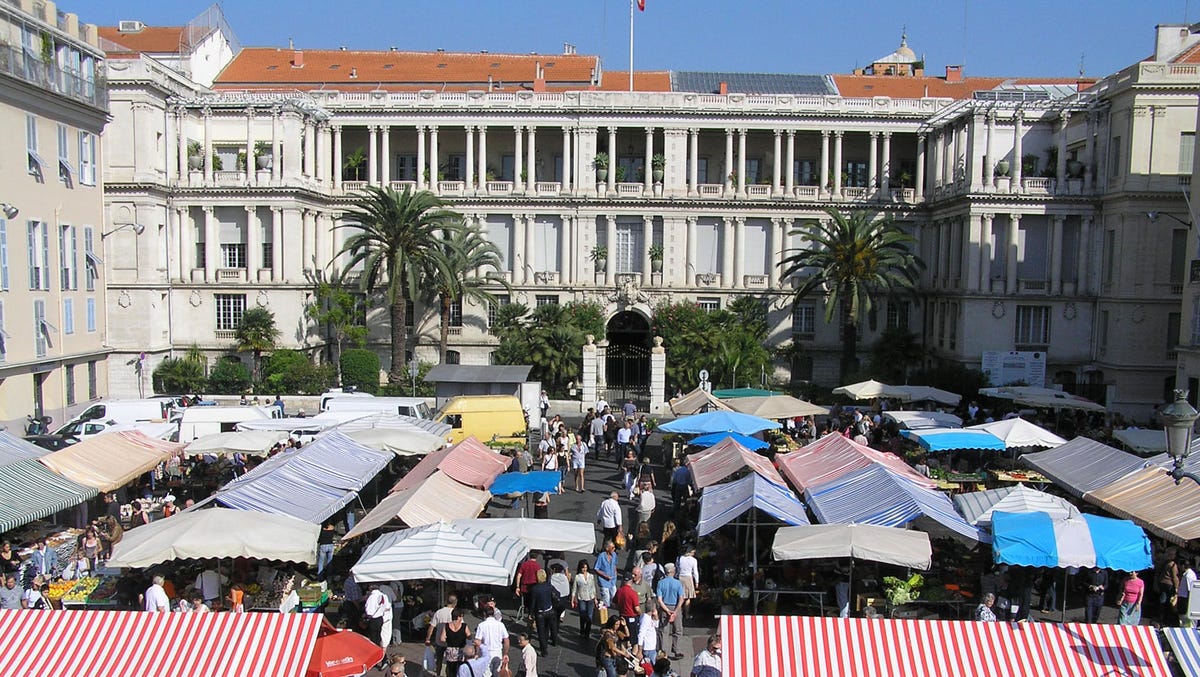 17. Cours Saleya, Nice, France: Known primarily as a flower market, the famous Cours Saleya also sells fresh produce, like plump red tomatoes, a Niçoise cooking essential. The popular market is always crowded, and at night the open-air market becomes a covered eating area, creating a different atmosphere.
