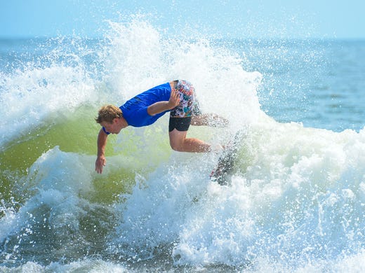 Sam Stinnett, Dana Point, Ca., catches a wave during