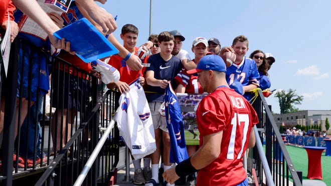 Jul 25, 2019;  Pittsford, NY, USA;  Buffalo Bills quarterback Josh Allen (17) signs autographs after training camp at St. John Fisher. Mandatory Credit: Mark Konezny-USA TODAY Sports