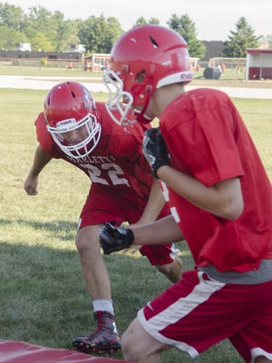 Marlette's Ethan McKenney closes in for a tackle in a tackle drill Wednesday, Aug. 10 , 2016 during their football practice at Marlette High School.