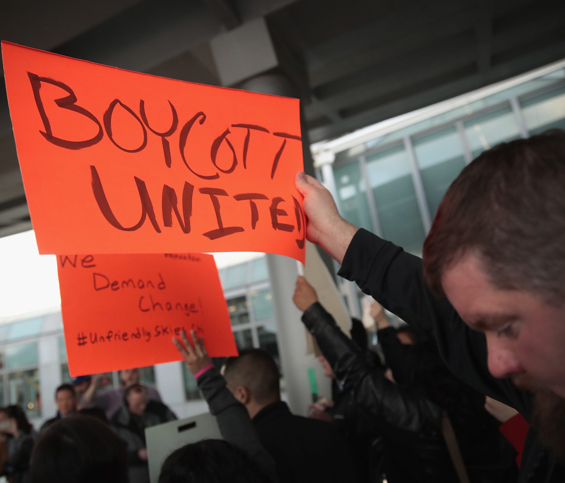 Demonstrators protest outside the United Airlines terminal at Chicago's O'Hare International Airport on April 11, 2017.