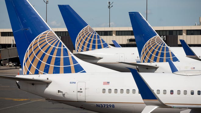 United Airlines jets await their next flights from at the airline's Newark Liberty International Airport hub in June 2018.