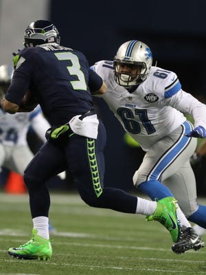 Lions defensive end Kerry Hyder rushes Seahawks quarterback Russell Wilson during the first quarter of a NFC wild-card playoff game Saturday, Jan. 7, 2017 at Centurylink Field in Seattle.