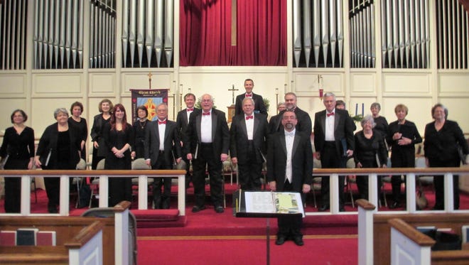 The Shrewsbury Chorale is conducted by Neil F. Brown (foreground).
