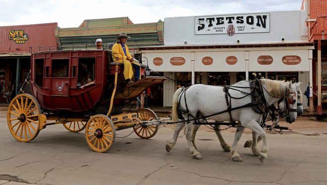 A stage coach travels down Allen Street in historic Tombstone, Ariz.