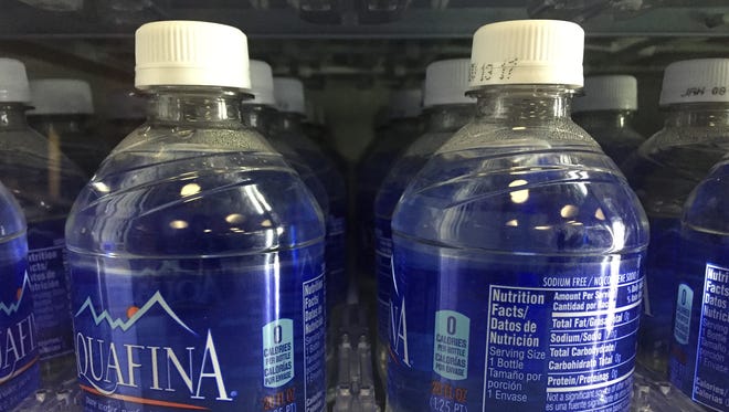 Water bottles in a vending machine.