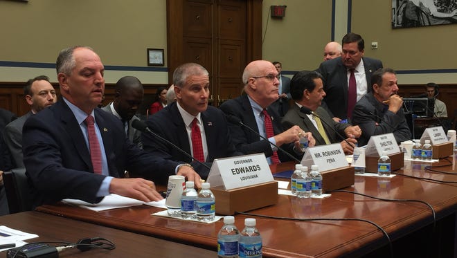 Gov. John Bel Edwards, (left), and other Louisiana officials testify before a House subcommittee on Sept. 9, 2016 about flood damage in their state.