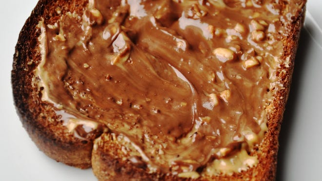 Toast with peanut butter and honey.