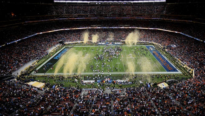 Confetti falls as the Denver Broncos celebrate defeating the Carolina Panthers 24-10 in Super Bowl 50 at Levi's Stadium on February 7, 2016 in Santa Clara, California.