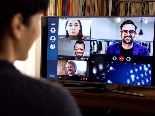 A person having a Zoom call from a home office.