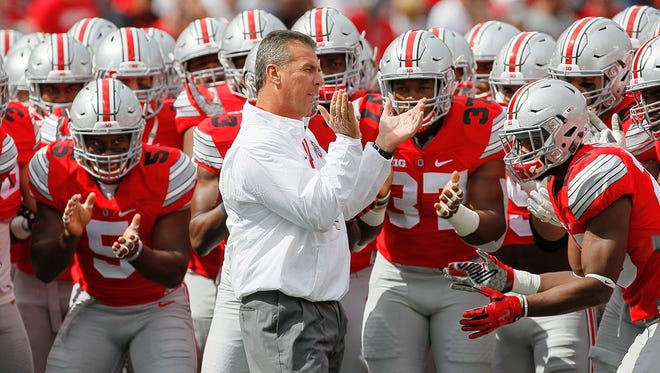 Ohio State head coach Urban Meyer pumps up his team to play Hawaii last Saturday in Columbus.