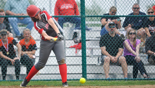 Johnstown's Alisha Slone hits a grounder against Cardington Saturday during the Division III district finals at Pickerington Central. The Johnnies lost 3-2.