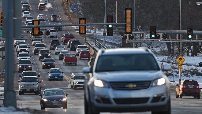 Motorists move through the intersection of 26th Street and Southeastern Avenue Thursday, Jan. 5, 2017, in Sioux Falls. Rush hour traffic on 26th Street isn't as bad as it used to be thanks to adaptive signal control technology, which was implemented at 10 intersections between Cliff Avenue and Veterans Parkway in 2014. 