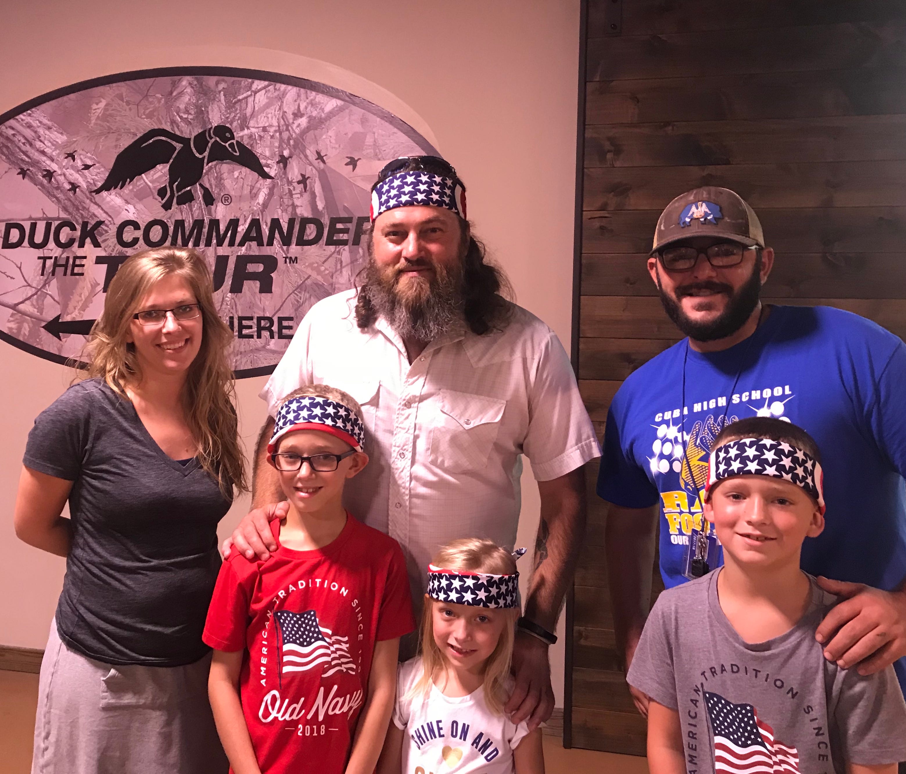 Duck Commander CEO Willie Robertson poses with fans before they entered the Duck Commander The Tour museum in West Monroe., La.