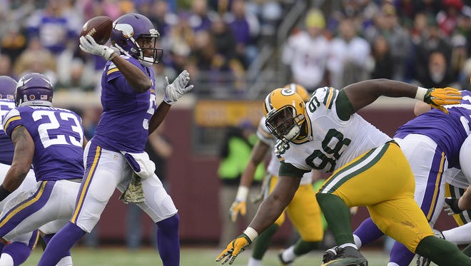Green Bay Packers defensive tackle Letroy Guion (98) pressures Minnesota Vikings quarterback Teddy Bridgewater (5) in the third quarter during Sunday's game at TCF Bank Stadium on the campus of the University of Minnesota in Minneapolis. Evan Siegle/Press-Gazette Media