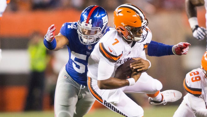 Cleveland Browns quarterback DeShone Kizer is sacked by Giants defensive end Olivier Vernon during the second quarter at FirstEnergy Stadium on Monday night.