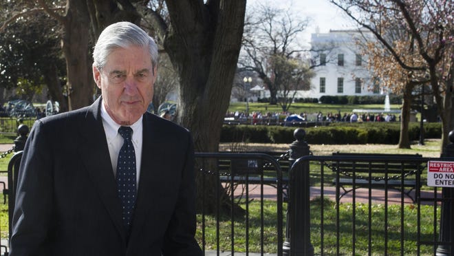 In this March 24, 2019 photo, Special Counsel Robert Mueller walks past the White House, after attending St. John's Episcopal Church for morning services, in Washington.