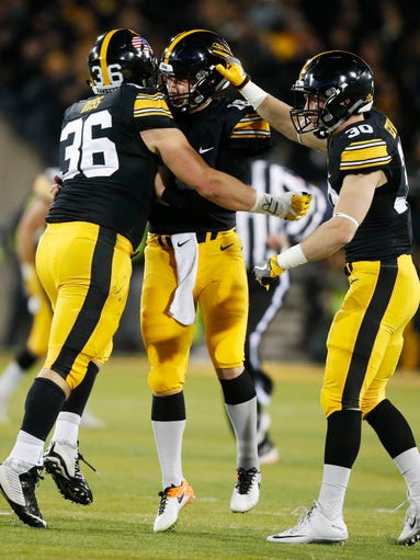 Iowa fullback Brady Ross(36) and Iowa safety Jake Gervase