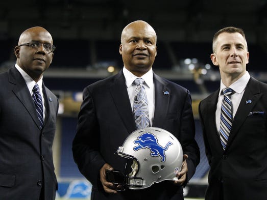 Lions general manager Martin Mayhew, left, and president