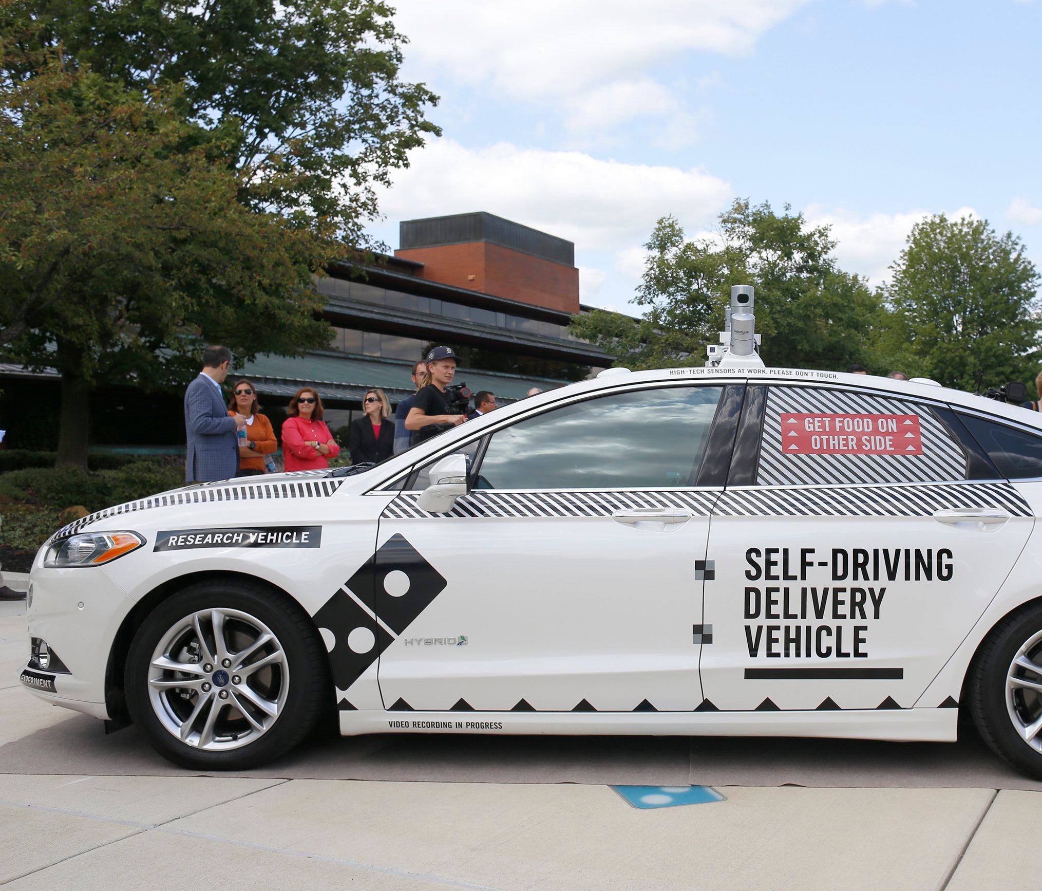 The Ford Fusion hybrid autonomous research vehicle, which will be used as the self-driving pizza delivery vehicle in a partnership between Ford and Domino's, photographed on Friday, August 25, 2017 at Domino's Farms in Ann Arbor.