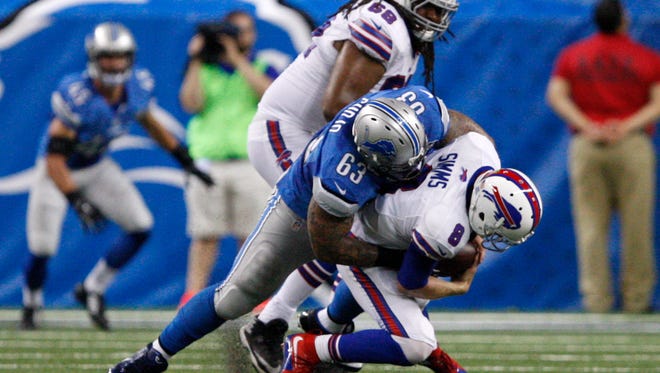 Detroit Lions defensive tackle Jermelle Cudjo (63) sacks Buffalo Bills quarterback Matt Simms (8).