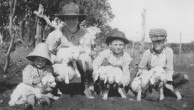 Gilbert Schmidt (third from left) as a little boy holds Angora goat kids with his maternal Grasso cousins.
