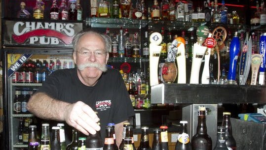 Dave Beauchamp, founder of Champ's Pub in downtown Brighton, exhibits some of his specialty beers that earned the pub an award for "Best Beer" in a 2014 reader poll.
