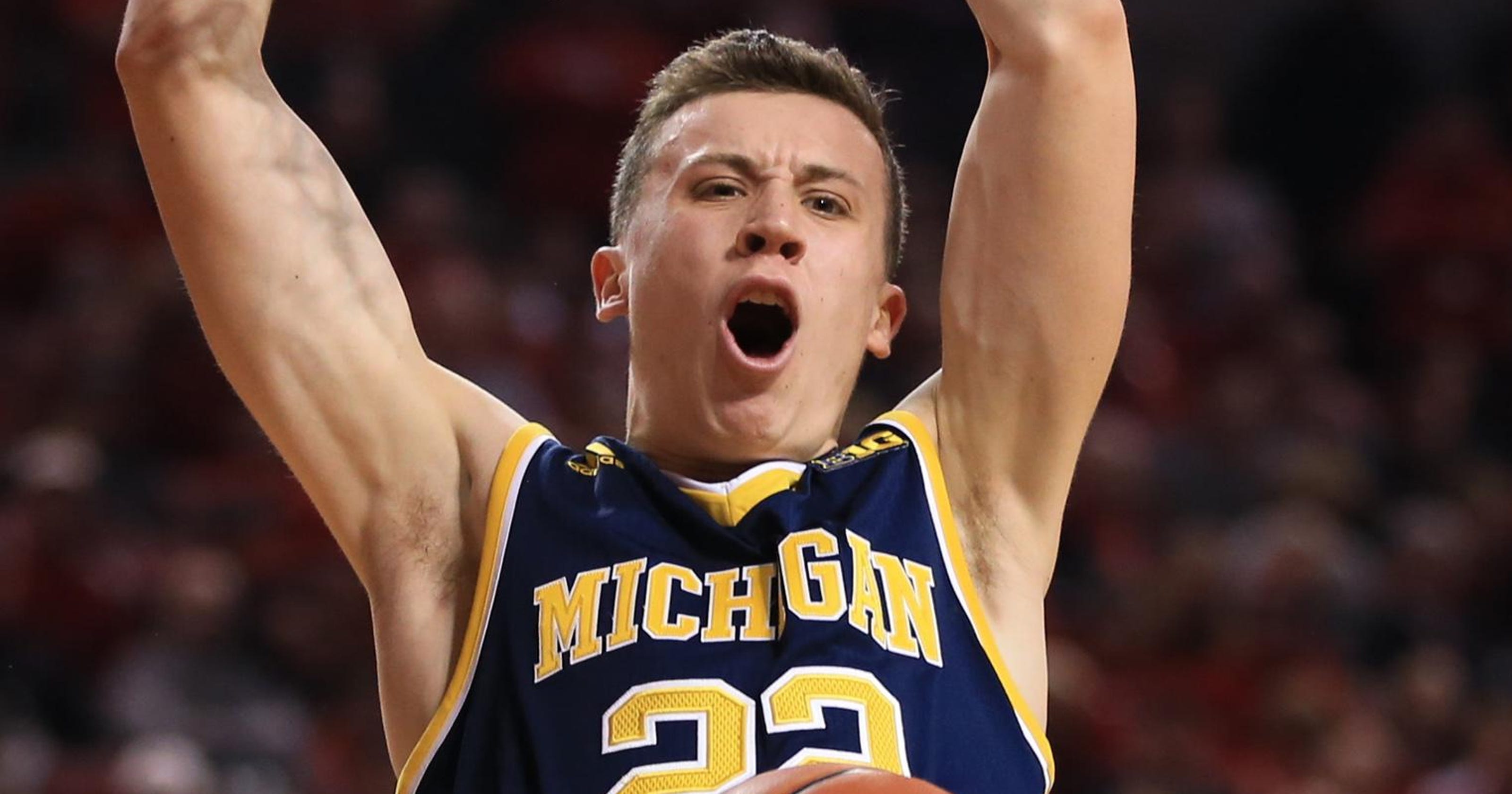 Michigan's Duncan Robinson working on getting his shot off ...