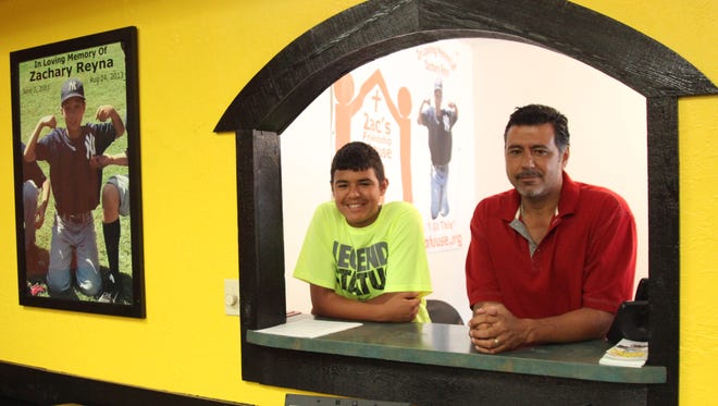Jesse Reyna, right, and Matt Reyna spend time together at Zac’s Friendship House,  which is to open Monday.