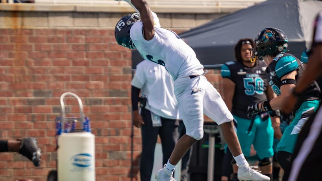 Georgia Southern's Malik Murray (16) makes a catch against host Coastal Carolina on Oct. 24, 2020 at Brooks Stadium in Conway, S.C.