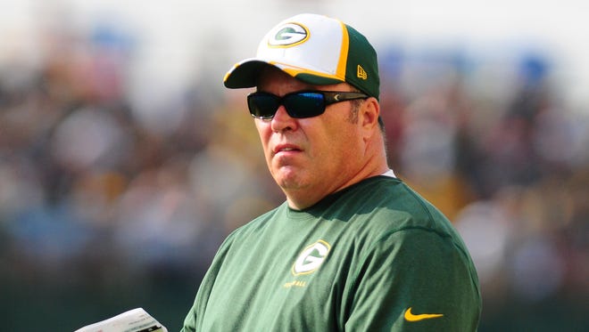 Green Bay Packers coach Mike McCarthy watches training camp practice at Ray Nitschke Field on Thursday, July 31, 2014.