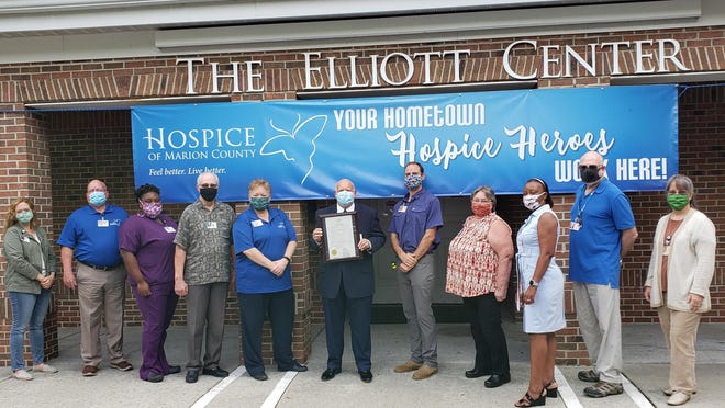 Left to right: MJ Schwartz, Bruce Chancellor, Easie Heflin-Parker, Darrell Poteet, Kelly Williams, Hospice of Marion County CEO Rick Bourne holding the Proclamation, Dan Bucnis, Paula Ray, Maureen Facey, Jay Abramson and Cathy Bowers.