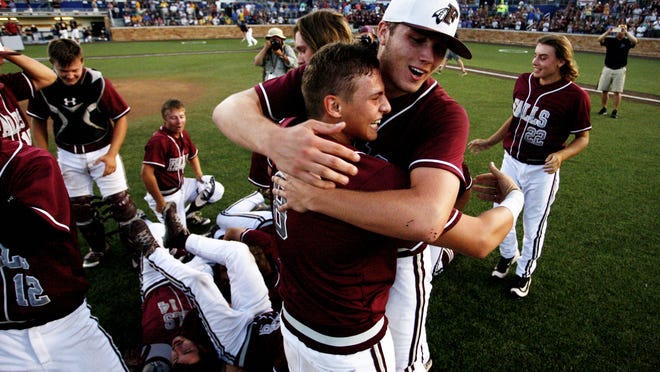 Menomonee Falls' Ty Weber, back, hugs Nick Gile (8) after defeating Marquette in the summer baseball state title game.