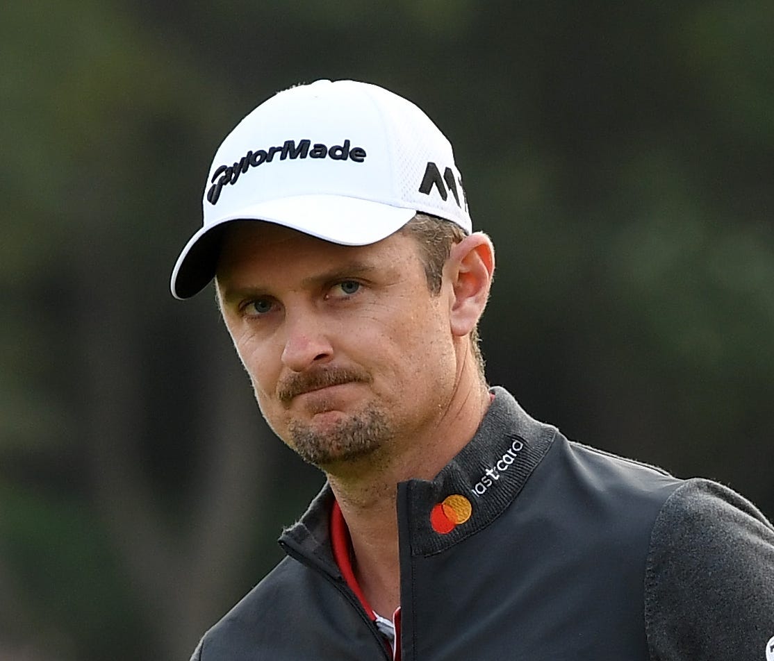 Justin Rose of England celebrates on the 18th green after winning the HSBC Champions at Sheshan International Golf Club.