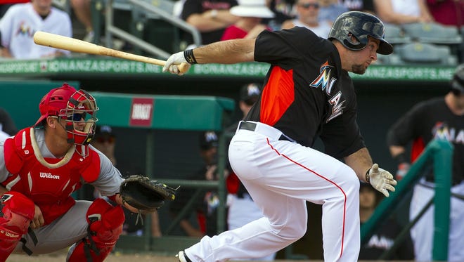 Miami Marlins third baseman Zack Cox connects for a hit against the St. Louis Cardinals on Feb. 23, 2013.