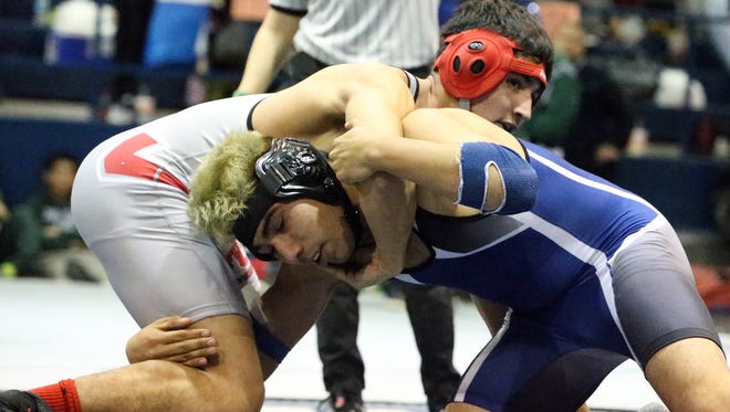 Zachariah Daly, top, of Jefferson grapples with Derek Armendariz of Bowie during the Bowie Wrestling Tournament. Armendairz won the finals match in the boys 160 pound class.
