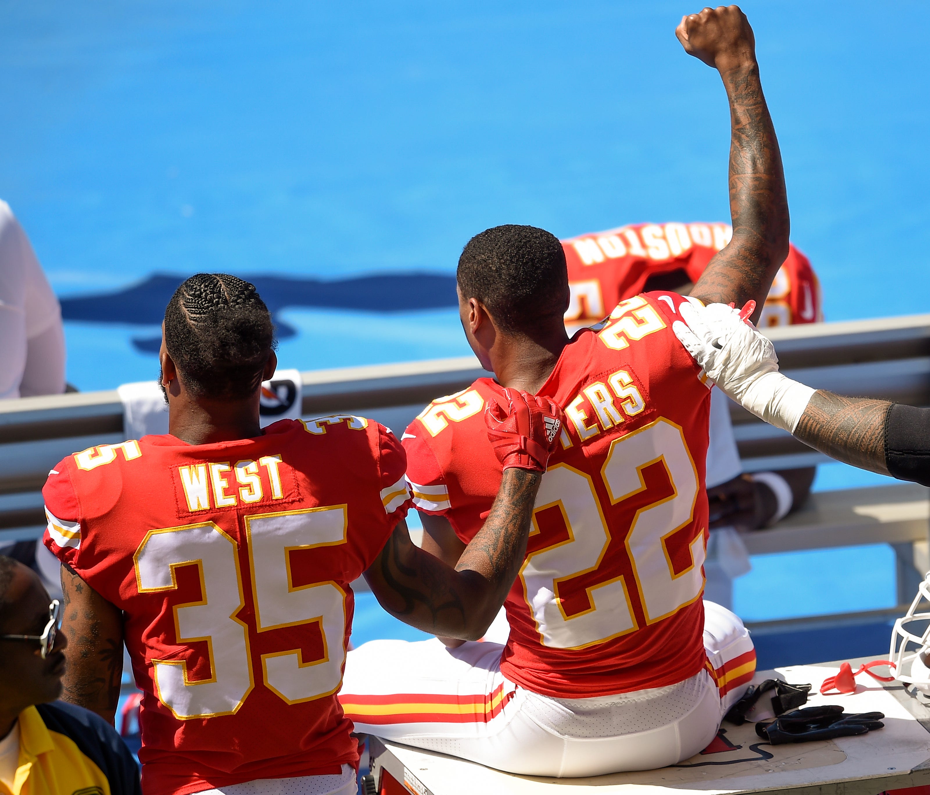 Chiefs CB Marcus Peters (22) protests next to RB Charcandrick West (35) Sunday in Los Angeles.