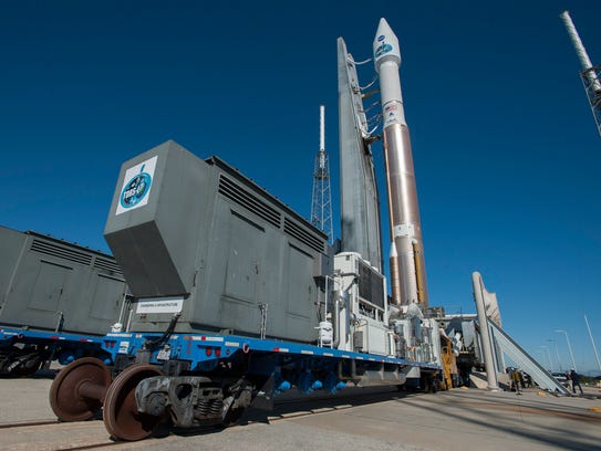 An Atlas V rocket with NASA's TDRS-L satellite rolls