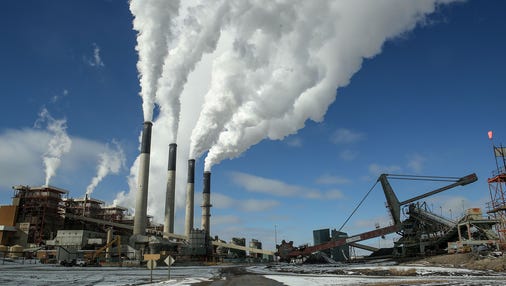 Large stacks fill the sky with steam at PacifiCorp's Jim Bridger coal plant in southwestern Wyoming on Dec. 7, 2016.