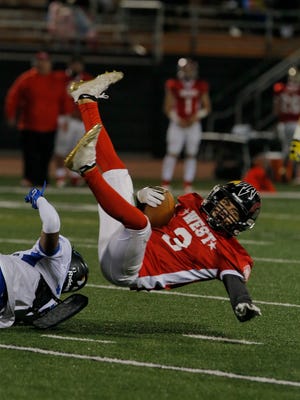 Rio Mesa’s Jacob Carbajal is upended by Westlake’s Jalen Turner during the 45th annual Ventura County High School All-Star Football Game on Saturday night at Ventura College.