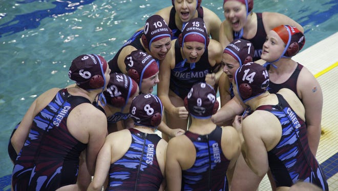 The Okemos water polo team gets fired up before their state quarterfinal match against Rockford Friday, June 3, 2016, at East Lansing High School.