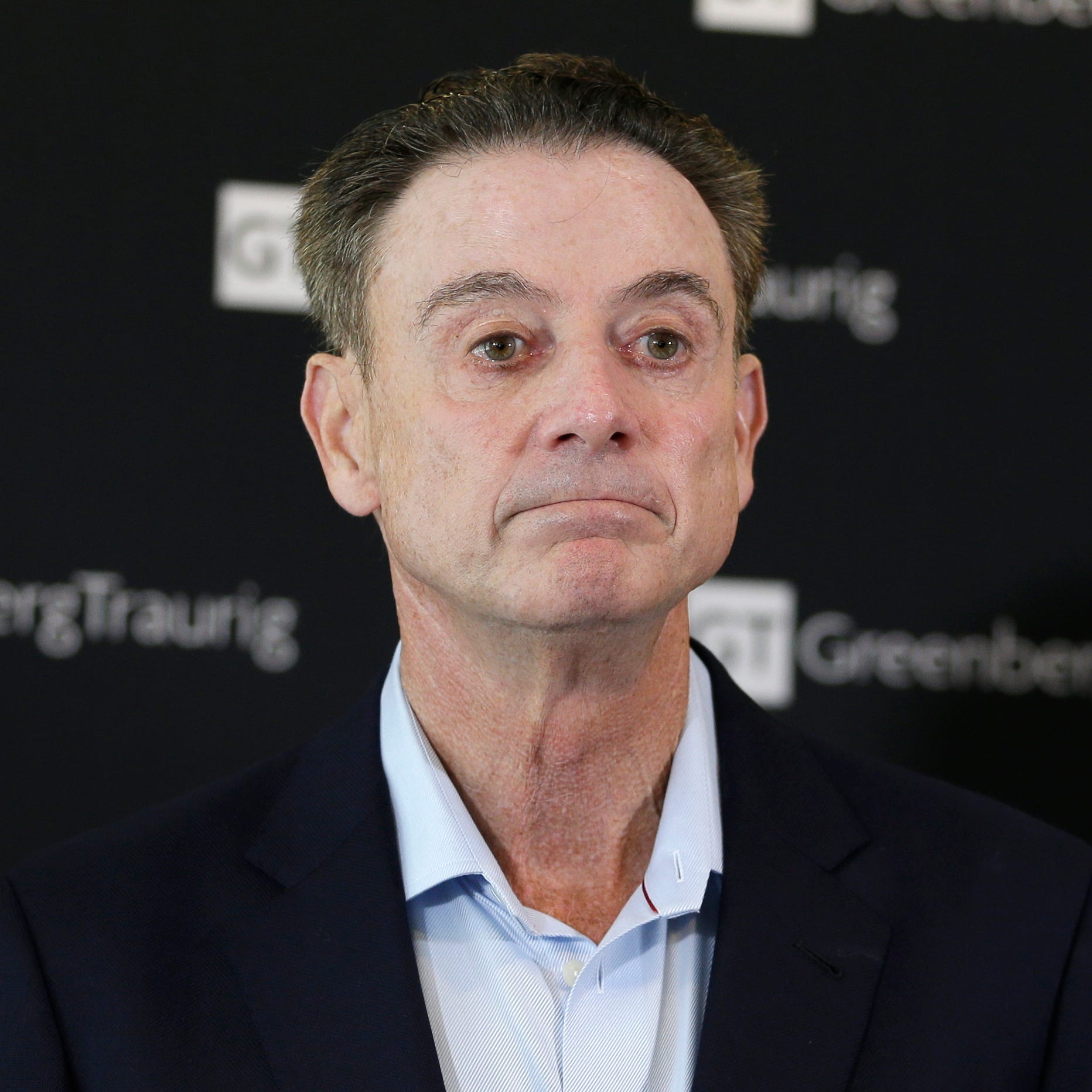 Former Louisville basketball coach Rick Pitino talks to reporters during a news conference in New York, Wednesday, Feb. 21, 2018. Pitino held the news conference in the wake of an NCAA decision in a sex scandal case that strips the Cardinals program 
