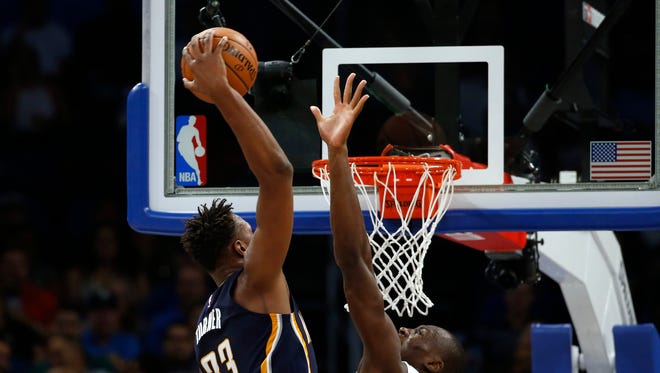 Indiana Pacers forward Myles Turner (33) dunks over Orlando Magic center Bismack Biyombo (11) during the second half at Amway Center. Orlando Magic defeated the Indiana Pacers 114-106.