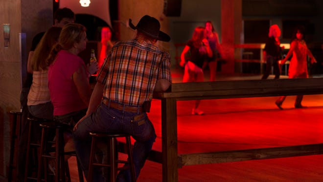
Line dance enthusiasts take advantage of the 4,000-square-foot dance floor at The Ranch Concert Hall and Saloon on Colonial Boulevard in Fort Myers on Saturday (10/18/14). The new business is located at a former 25,000-square-foot Toys-R-Us store, and its first concert featuring Josh Turner and Gloriana is planned for Nov. 16.
