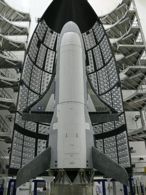 At the Astrotech facility in Titusville in April 2010, the Air Force’s first X-37B Orbital Test Vehicle awaited encapsulation in an Atlas V rocket fairing.