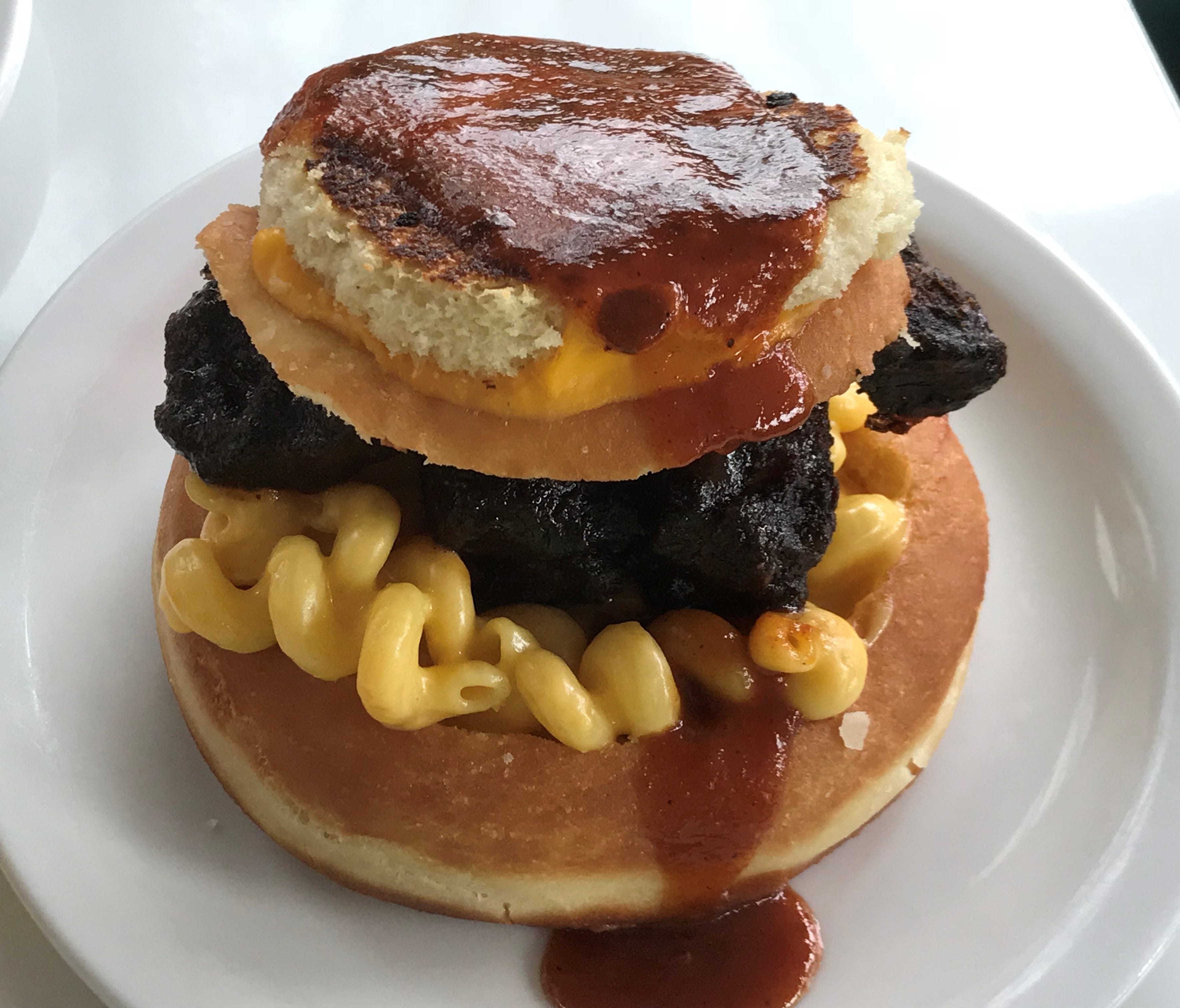 Among the savory Hi-Tops, the most popular is the Mac Rib, a fried doughnut-like pastry topped with mac and cheese and pork ribs, a pastry crown – and a mini grilled cheese sandwich.