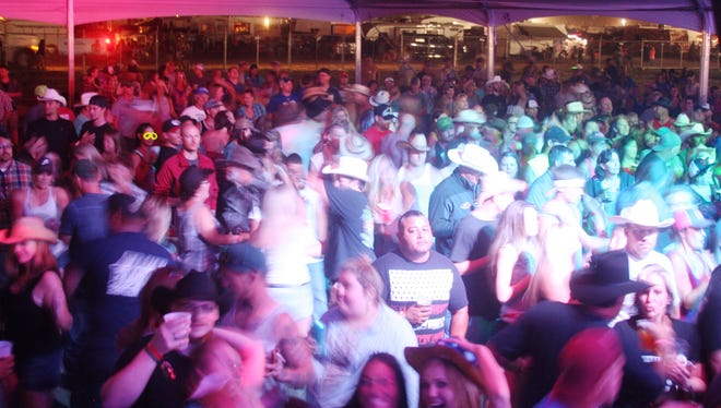 Fans attend a concert at the Night in the Country's Full Moon Saloon in Yerington July 24.